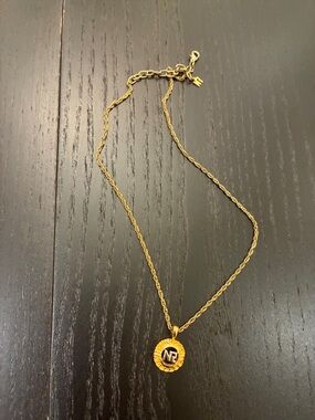 Nina Ricci gold-tone logo pendant necklace 👝
